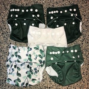 5 Nora’s Nursery cloth diapers with inserts and wet bag
